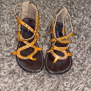 Size 7. Camel sandals with gold accents